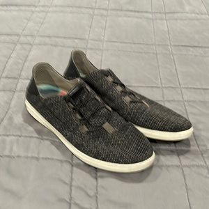 Olukai sneakers woven fabric with a leather back.